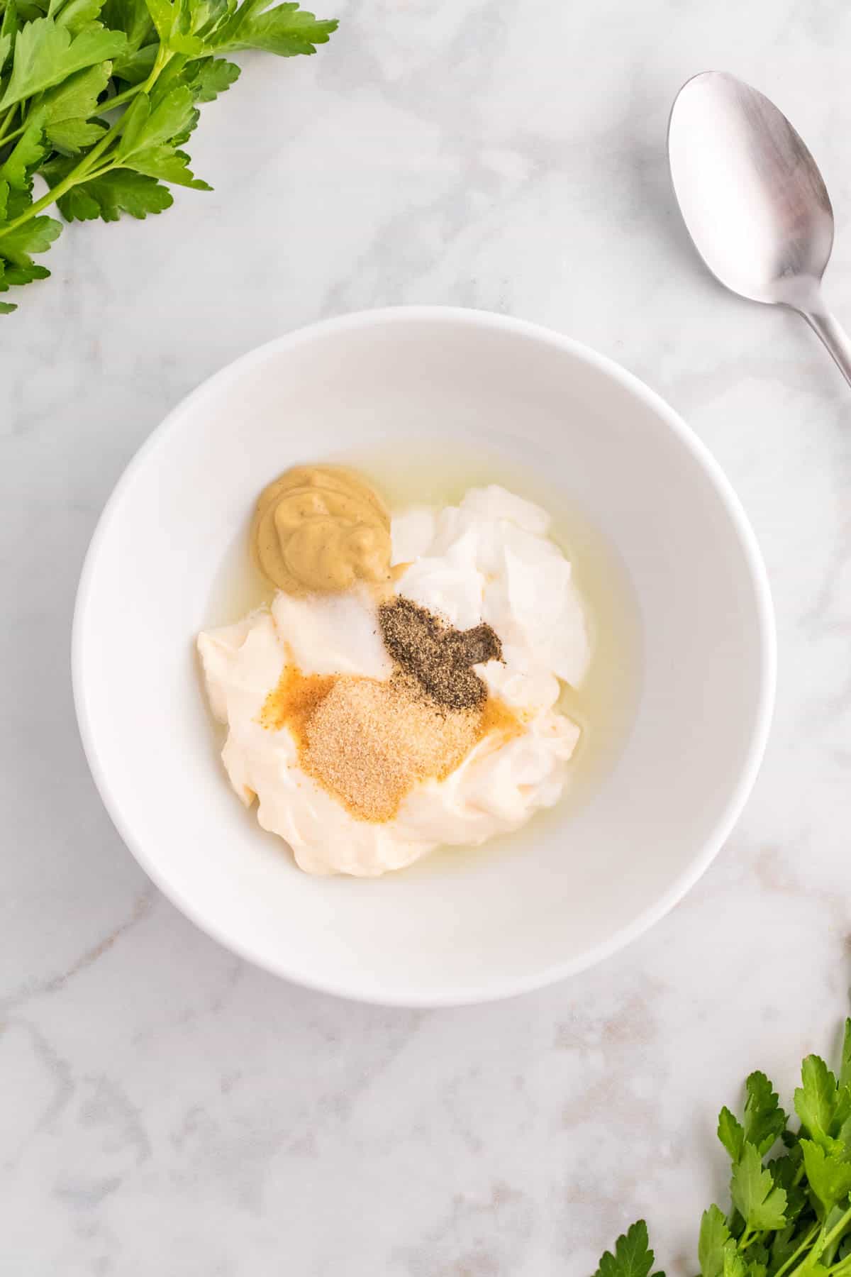 mayo, sour cream, mustard and seasonings in a bowl.