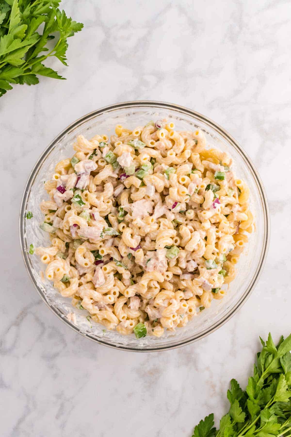 macaroni salad after stirring in a bowl