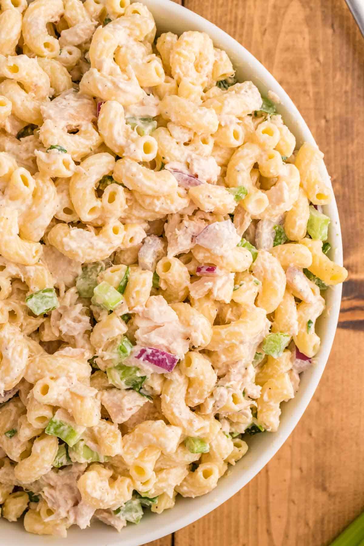 Tuna Macaroni Salad is a classic pasta salad recipe loaded with canned tuna, chopped celery, diced red onions and green peppers all tossed in a seasoned mayo dressing.