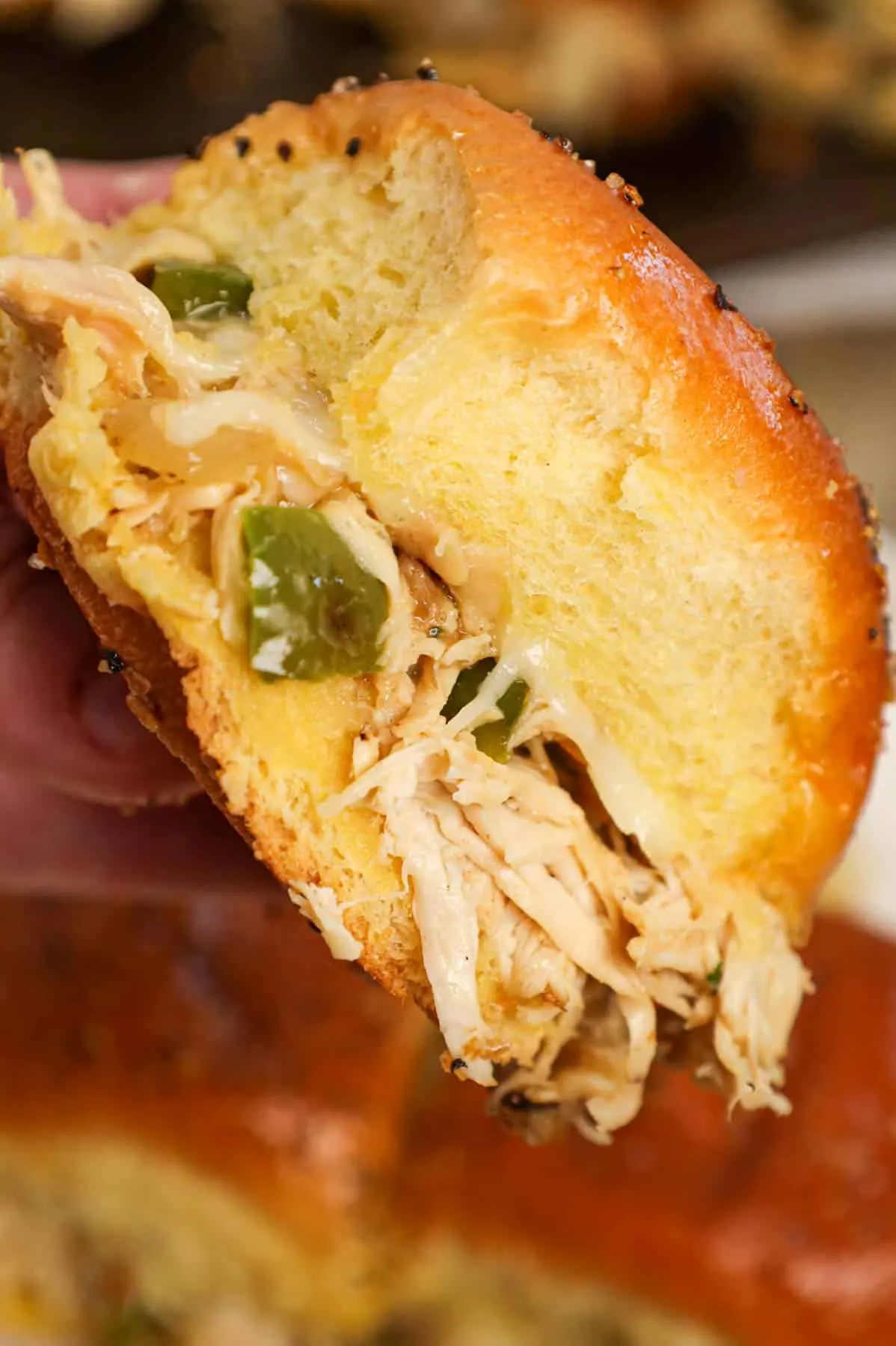 Chicken Philly Sliders are delicious mini sandwiches on brioche dinner rolls loaded with shredded chicken, green bell peppers, onions and Provolone cheese.