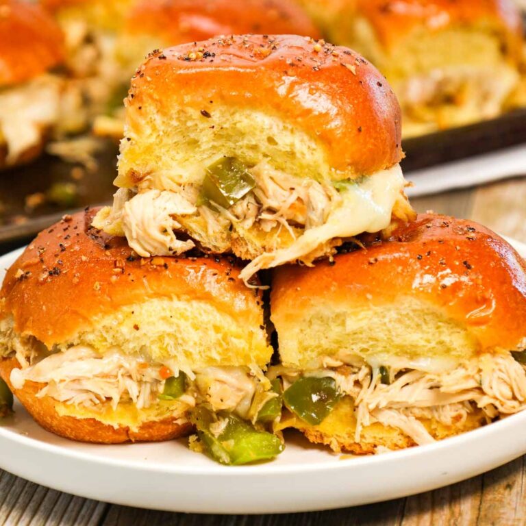 Chicken Philly Sliders are delicious mini sandwiches on brioche dinner rolls loaded with shredded chicken, green bell peppers, onions and Provolone cheese.