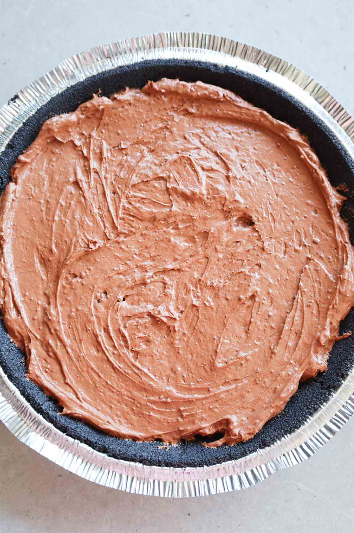 chocolate pudding mixture in an Oreo pie crust