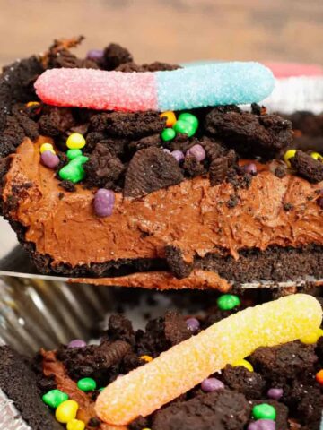 Dirt Pie is a fun and easy no bake pie recipe made with an Oreo pie crust with a chocolate filling and topped with crumbled dark chocolate Oreo cookies and gummy worms.