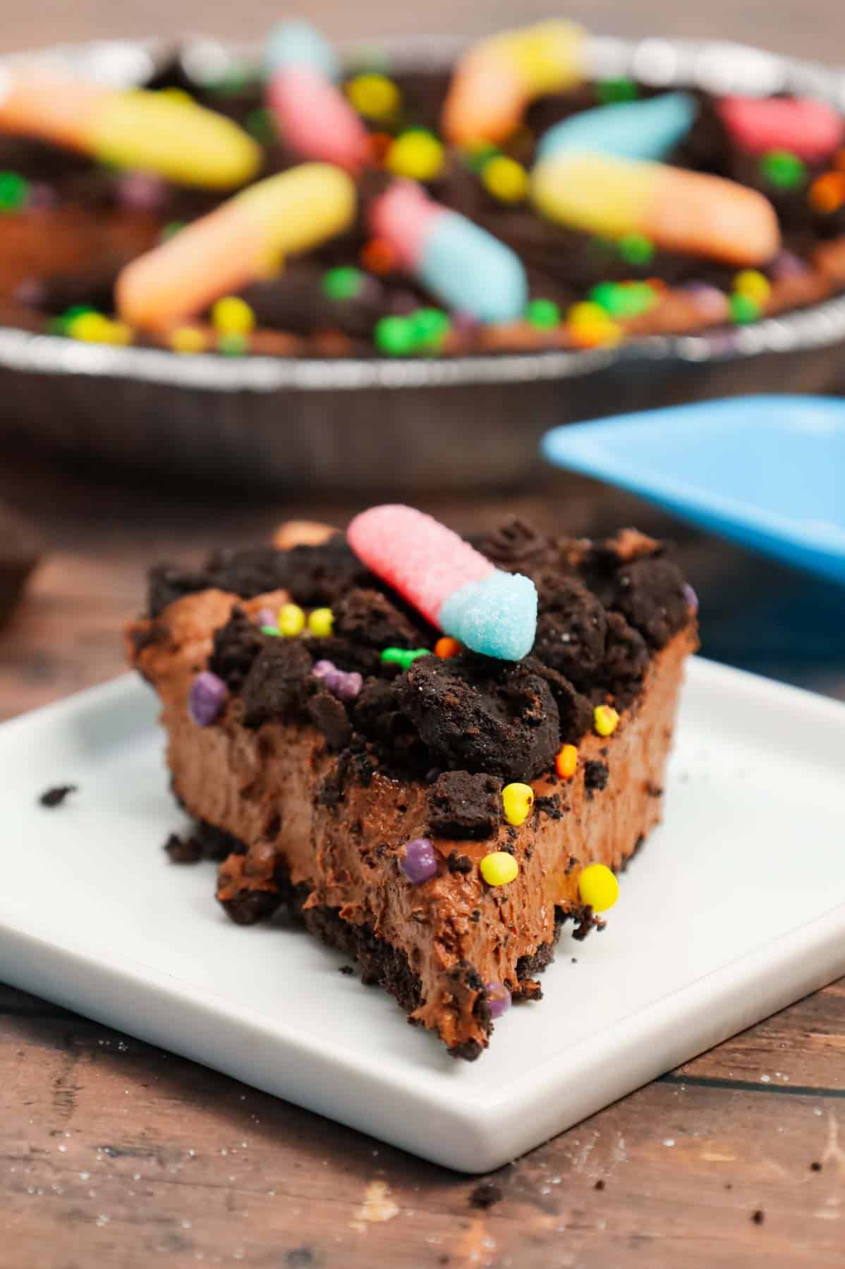 Dirt Pie is a fun and easy no bake pie recipe made with an Oreo pie crust with a chocolate filling and topped with crumbled dark chocolate Oreo cookies and gummy worms.