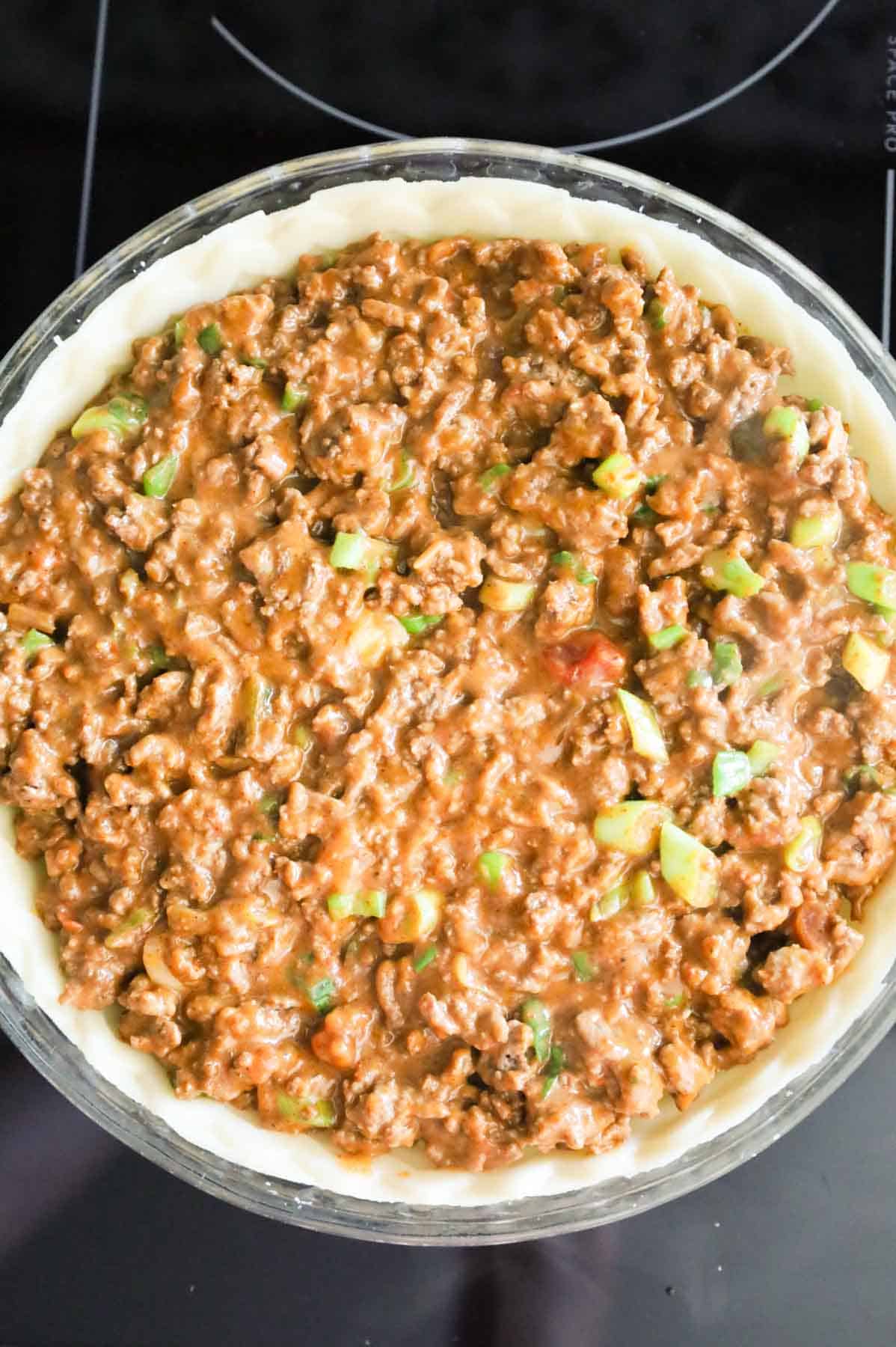 ground beef taco mixture in a pie shell