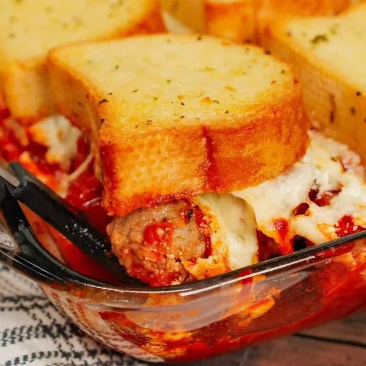 Dump and Bake Meatball Casserole is a hearty casserole made with frozen Italian meatballs, marinara sauce, diced tomatoes, ricotta and mozzarella and topped with frozen Texas toast garlic bread.