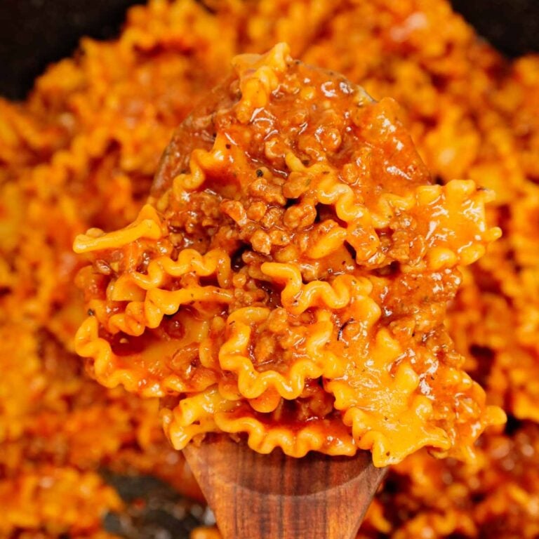 Hamburger Helper Lasagna is an easy ground beef dinner recipe using pasta that looks like mini lasagna noodles, tomato sauce, Italian seasoning, beef broth, shredded mozzarella and parmesan cheese.