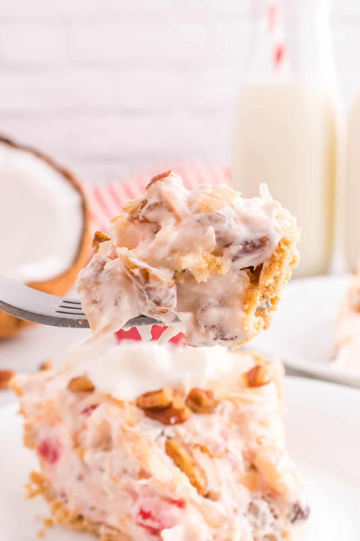 Million Dollar Pie is a creamy no bake pie loaded with crushed pineapple, chopped pecans, toasted coconut, maraschino cherries, mini marshmallows and chocolate chips all in a graham cracker crust.