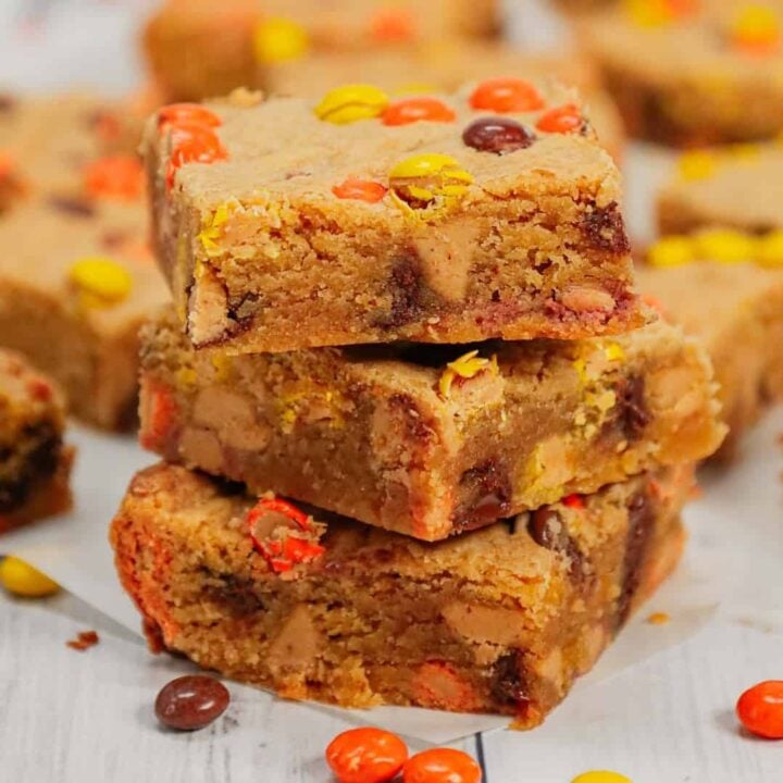 Peanut Butter Blondies are chewy peanut butter bars loaded with peanut butter baking chips, chocolate chips and mini Reese's pieces candies.