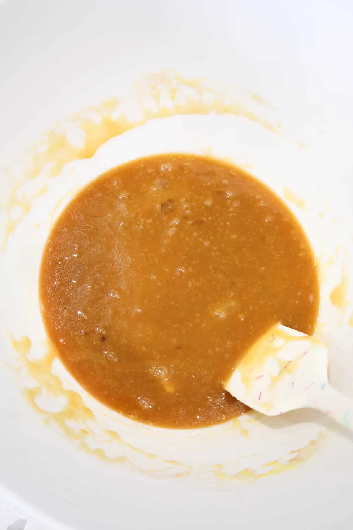 brown sugar, egg and melted butter mixture in a mixing bowl