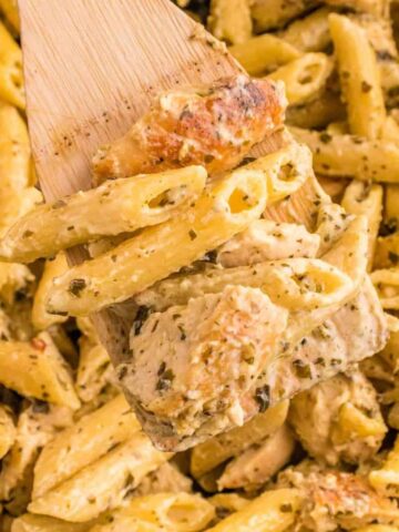 Pesto Chicken Pasta is a flavourful pasta recipe loaded with seasoned chicken breast chunks, basil pesto, heavy cream and topped with roasted pine nuts.