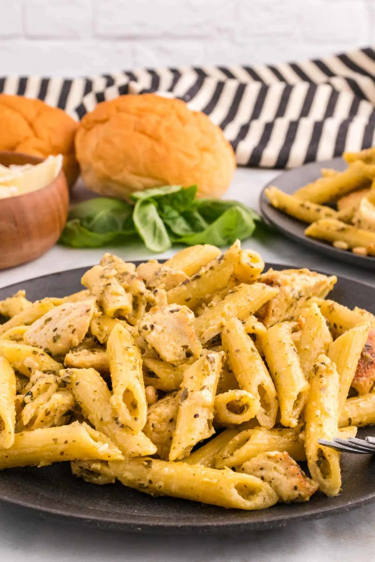 Pesto Chicken Pasta is a flavourful pasta recipe loaded with seasoned chicken breast chunks, basil pesto, heavy cream and topped with roasted pine nuts.