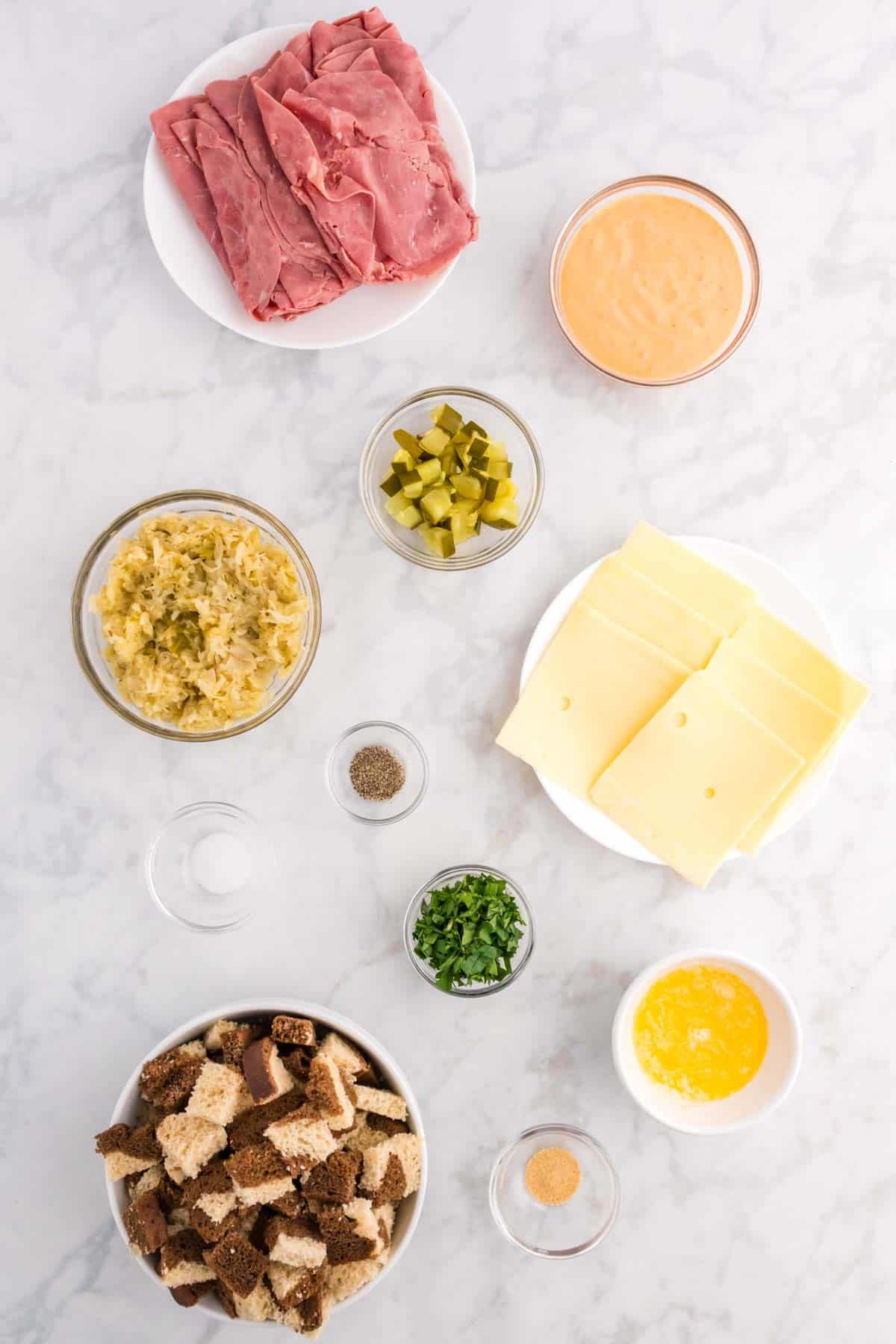 reuben casserole ingredients in prep bowls