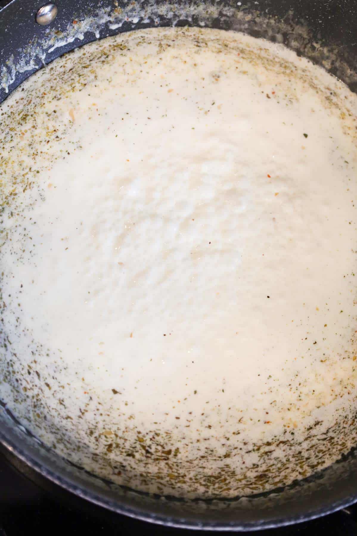 creamy sauce simmering in a skillet