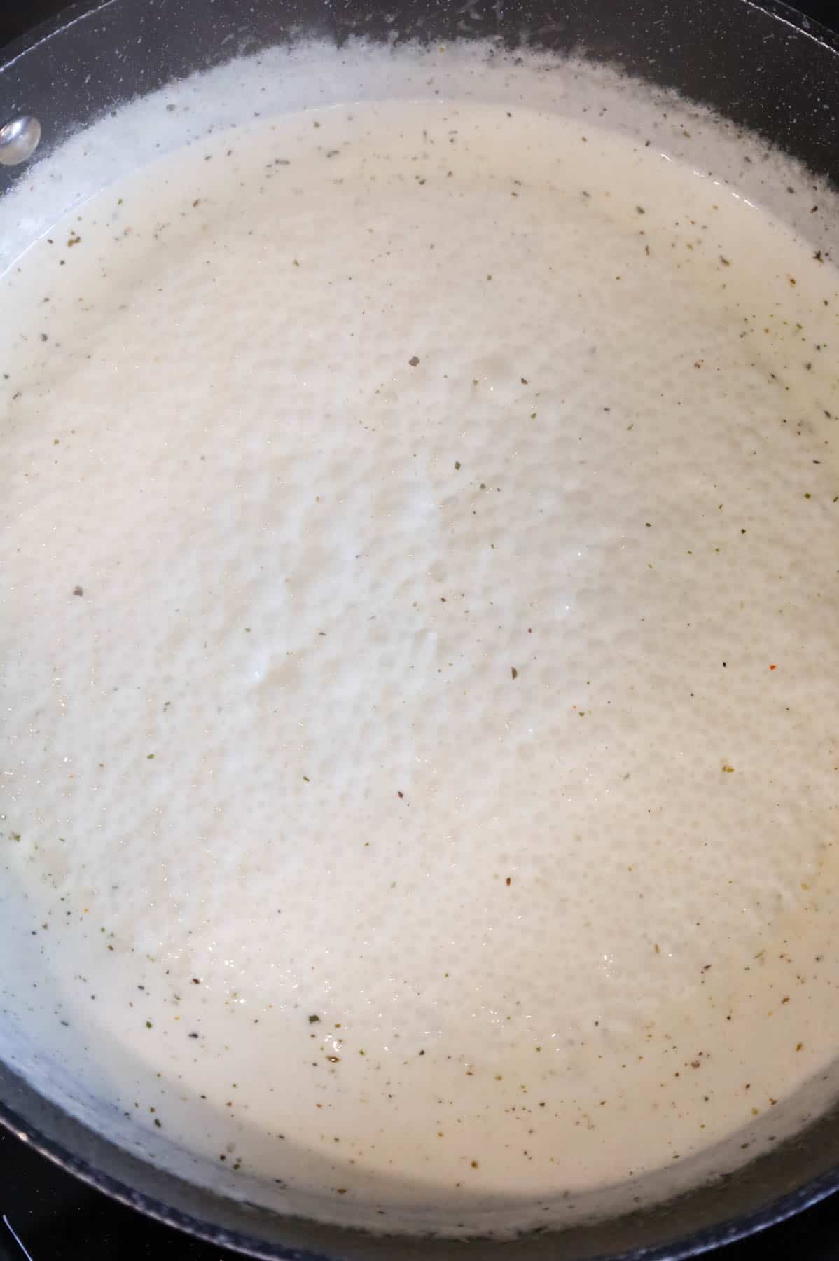 cream sauce simmering in a skillet