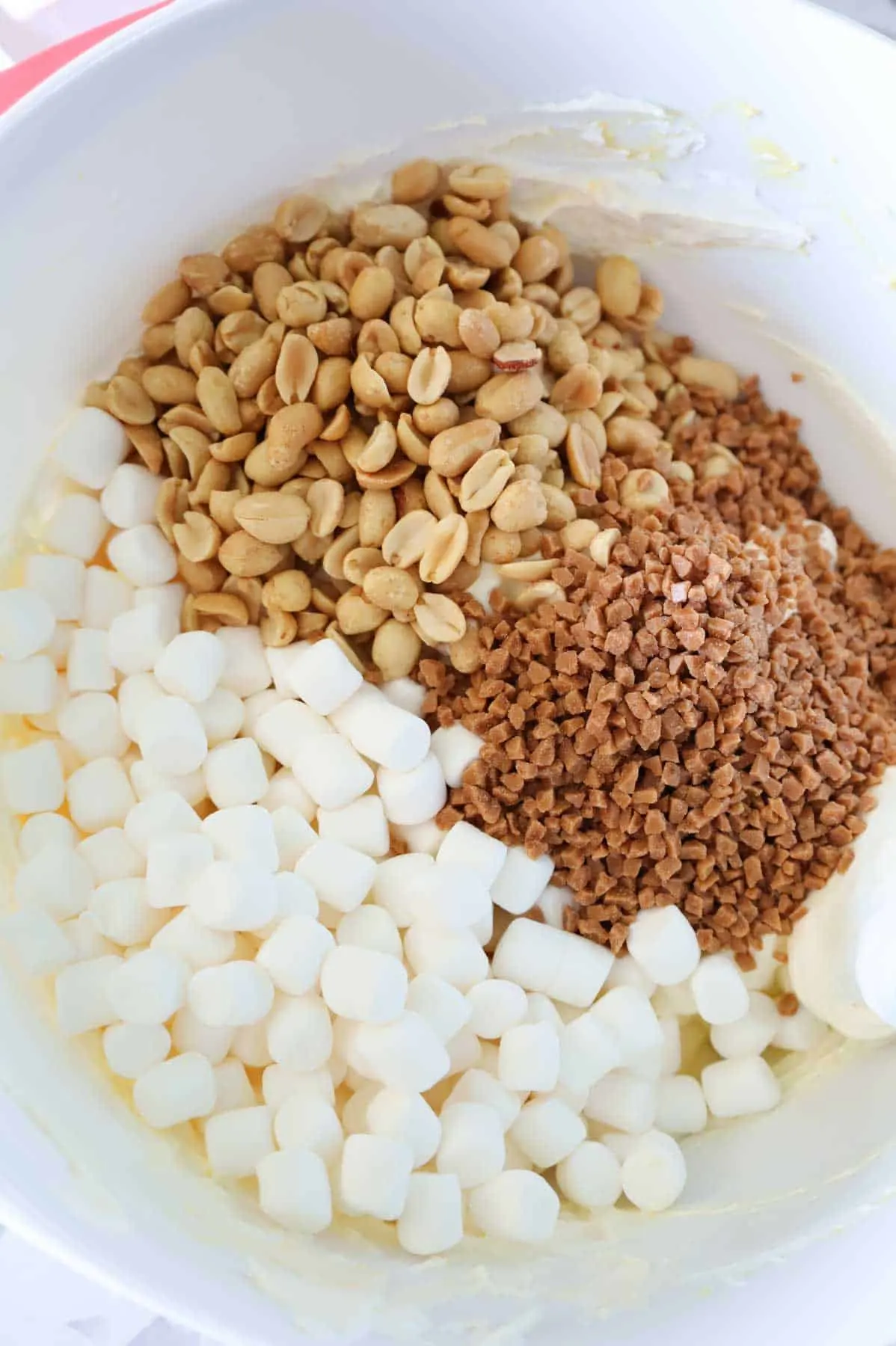 salted peanuts, Skor bits and mini marshmallows in a mixing bowl