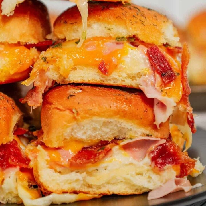 Turkey Bacon Ranch Sliders are small baked sandwiches loaded with chopped deli turkey, ranch dressing, crispy bacon and cheddar cheese.