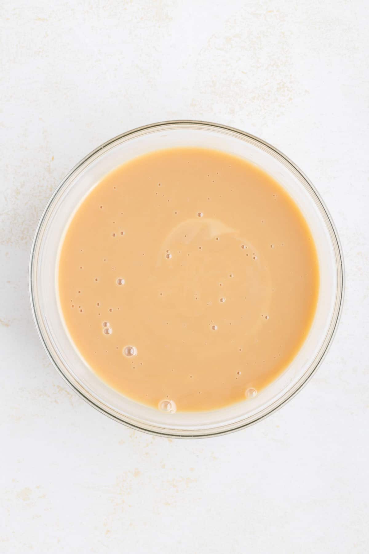 caramel and condensed milk mixture in a mixing bowl