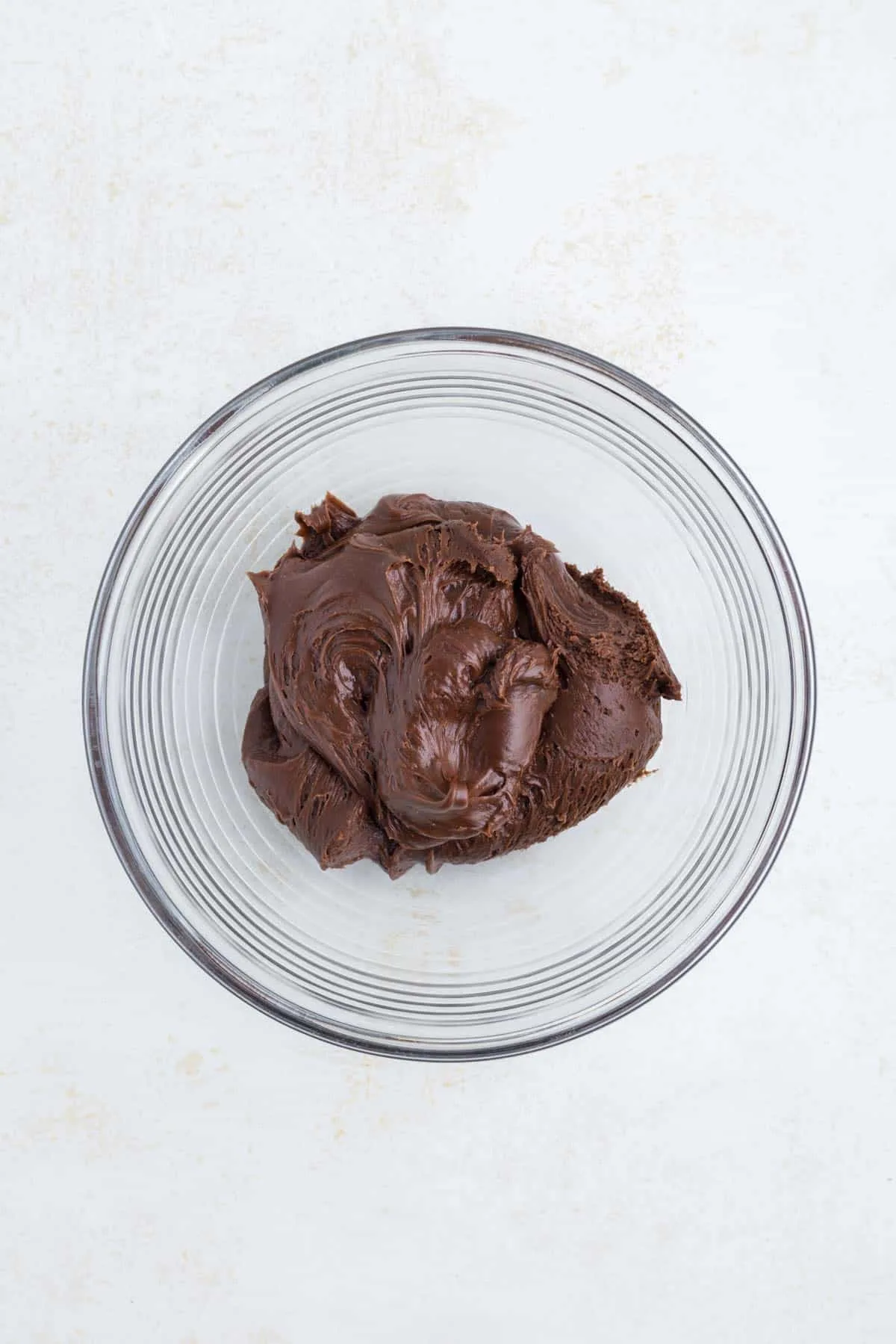 store bought chocolate frosting in a bowl
