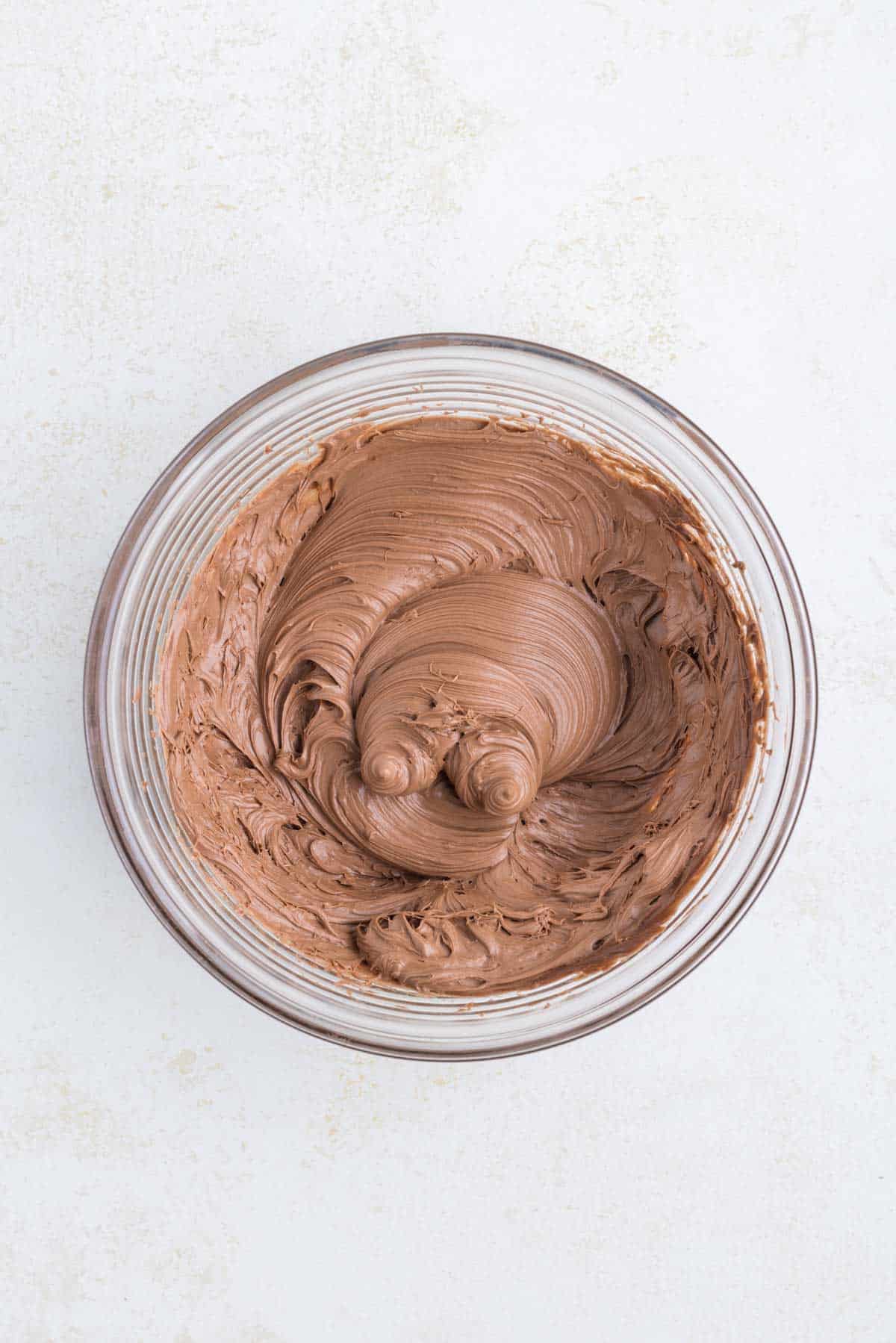 whipped chocolate frosting in a bowl