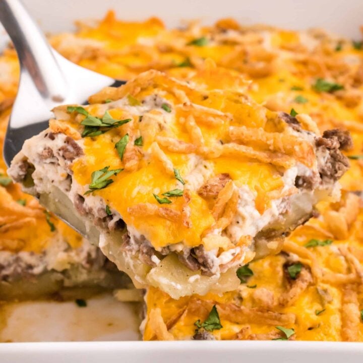 Hobo Casserole is a layered ground beef and sliced potato casserole loaded with diced bell peppers, onions, sour cream, cream of mushroom soup, cheddar cheese and French's crispy fried onions.