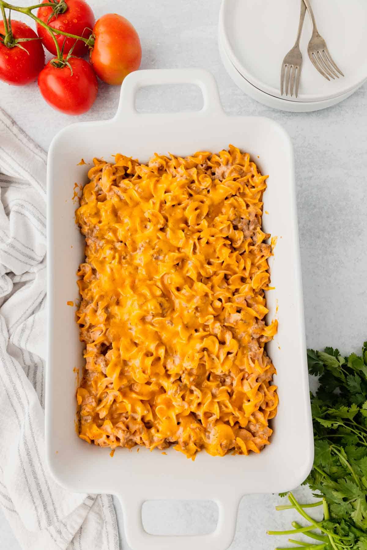 Beef Noodle Casserole is a hearty dish loaded with ground beef, egg noodles, cheddar cheese, sour cream and cream of mushroom soup.