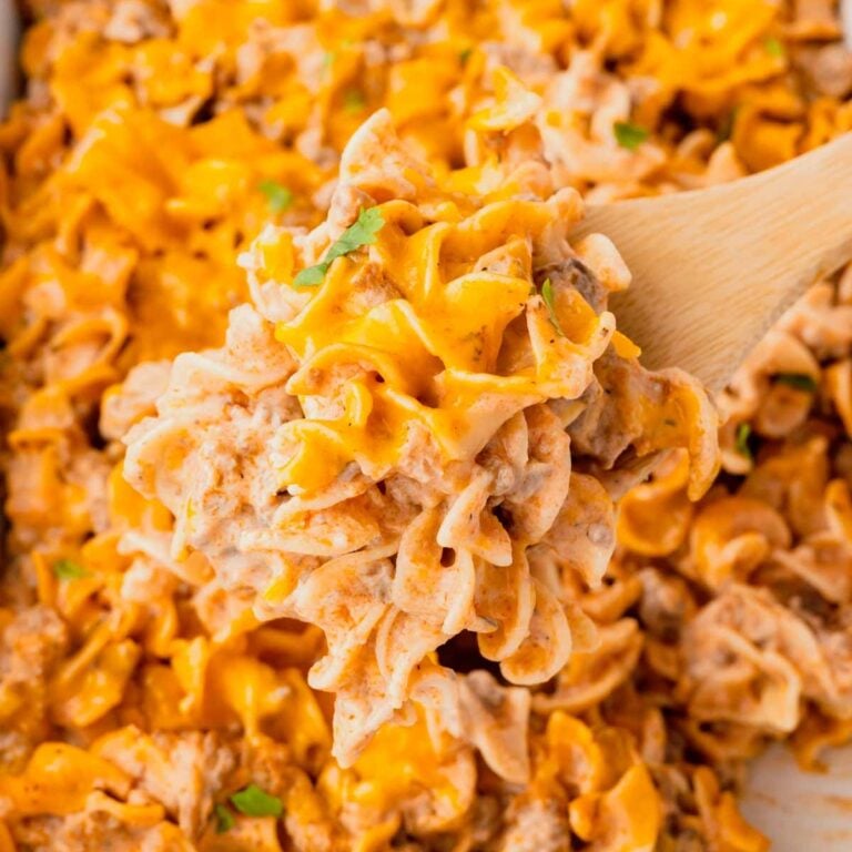 Beef Noodle Casserole is a hearty dish loaded with ground beef, egg noodles, cheddar cheese, sour cream and cream of mushroom soup.
