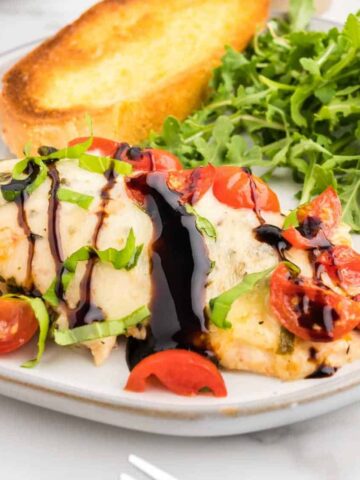 Bruschetta Chicken Bake is a simple baked chicken breast recipe loaded with cherry tomatoes, fresh basil, garlic and melty mozzarella cheese.