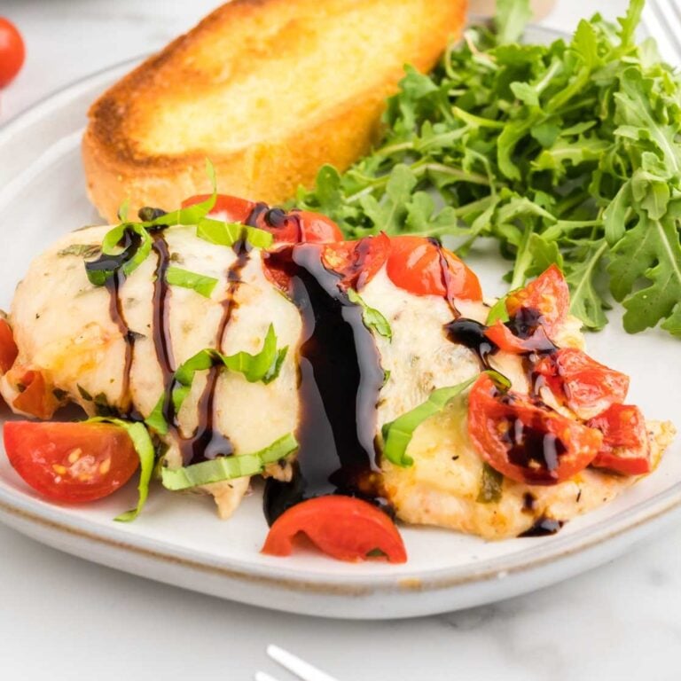 Bruschetta Chicken Bake is a simple baked chicken breast recipe loaded with cherry tomatoes, fresh basil, garlic and melty mozzarella cheese.
