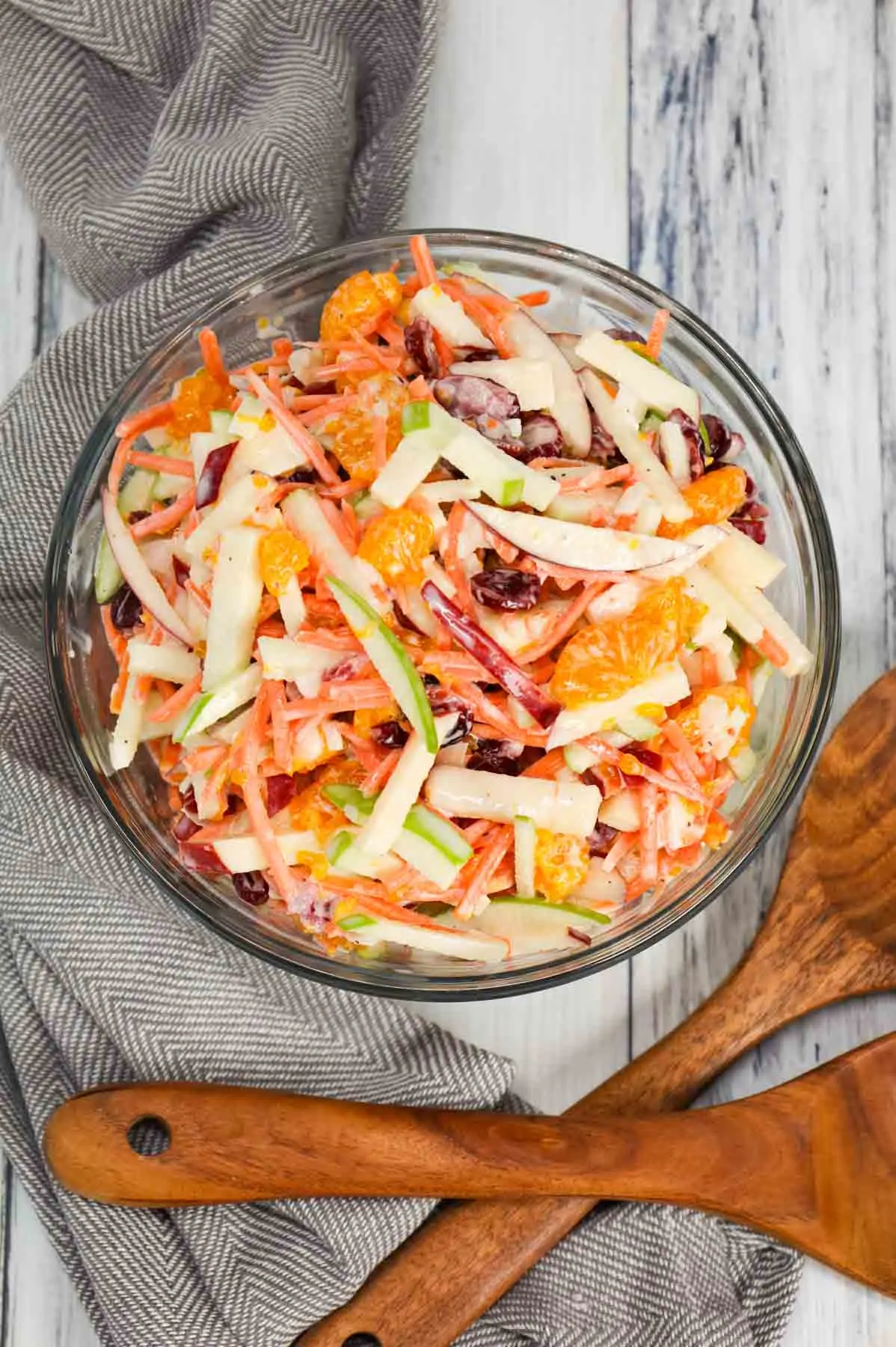 Carrot Apple Salad is a delicious and colourful salad loaded with sliced red and green apples, carrots, dried cranberries and mandarins all tossed in a vanilla yogurt and mayo dressing.