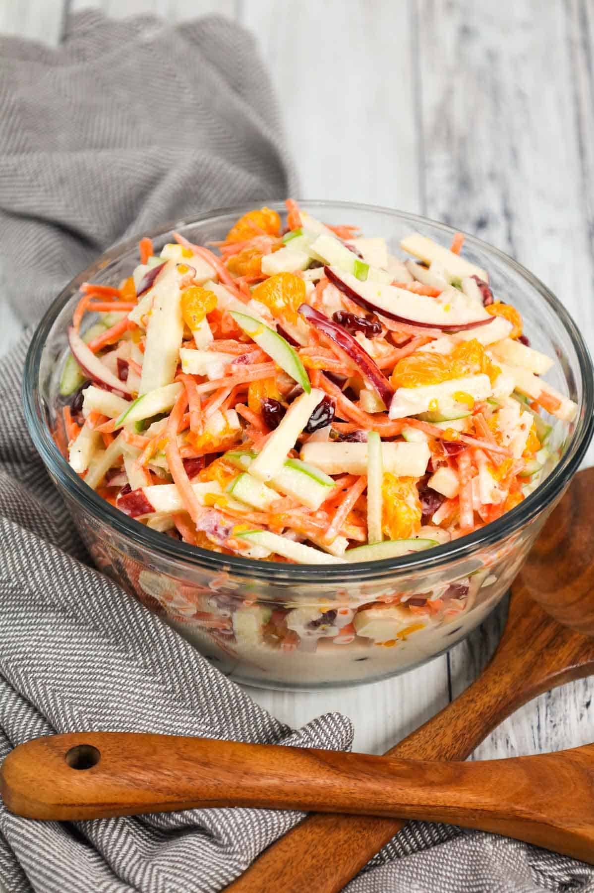 Carrot Apple Salad is a delicious and colourful salad loaded with sliced red and green apples, carrots, dried cranberries and mandarins all tossed in a vanilla yogurt and mayo dressing.