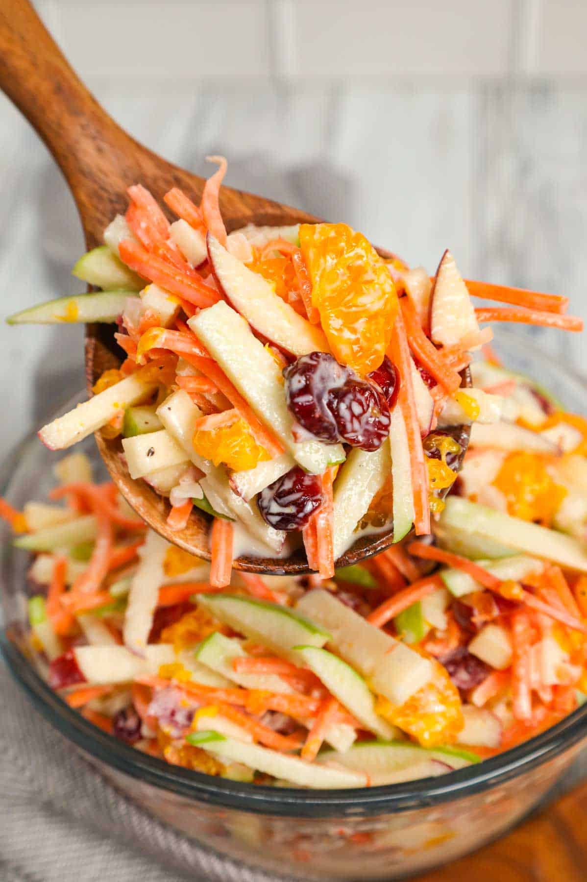 Carrot Apple Salad is a delicious and colourful salad loaded with sliced red and green apples, carrots, dried cranberries and mandarins all tossed in a vanilla yogurt and mayo dressing.