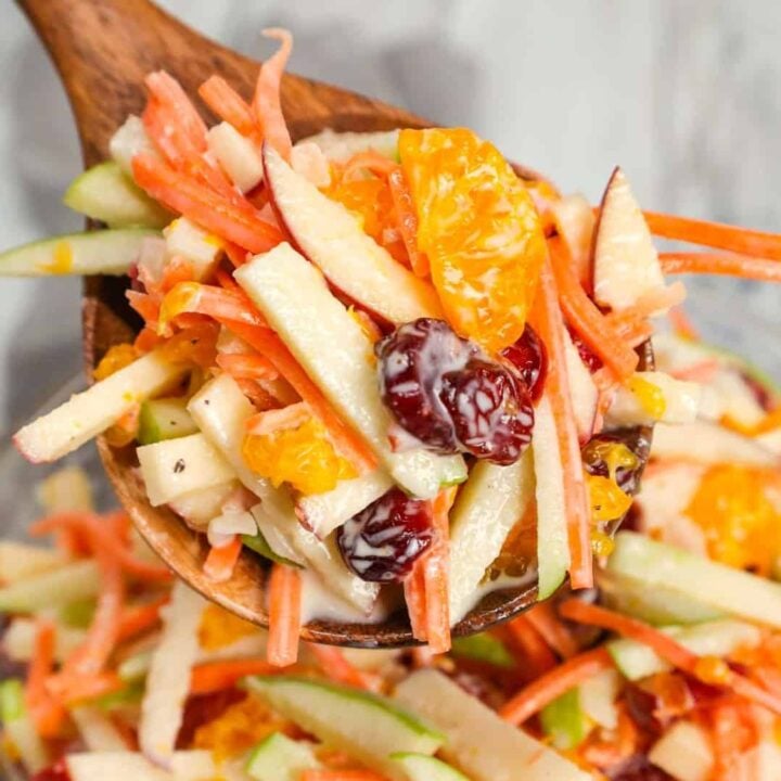 Carrot Apple Salad is a delicious and colourful salad loaded with sliced red and green apples, carrots, dried cranberries and mandarins all tossed in a vanilla yogurt and mayo dressing.