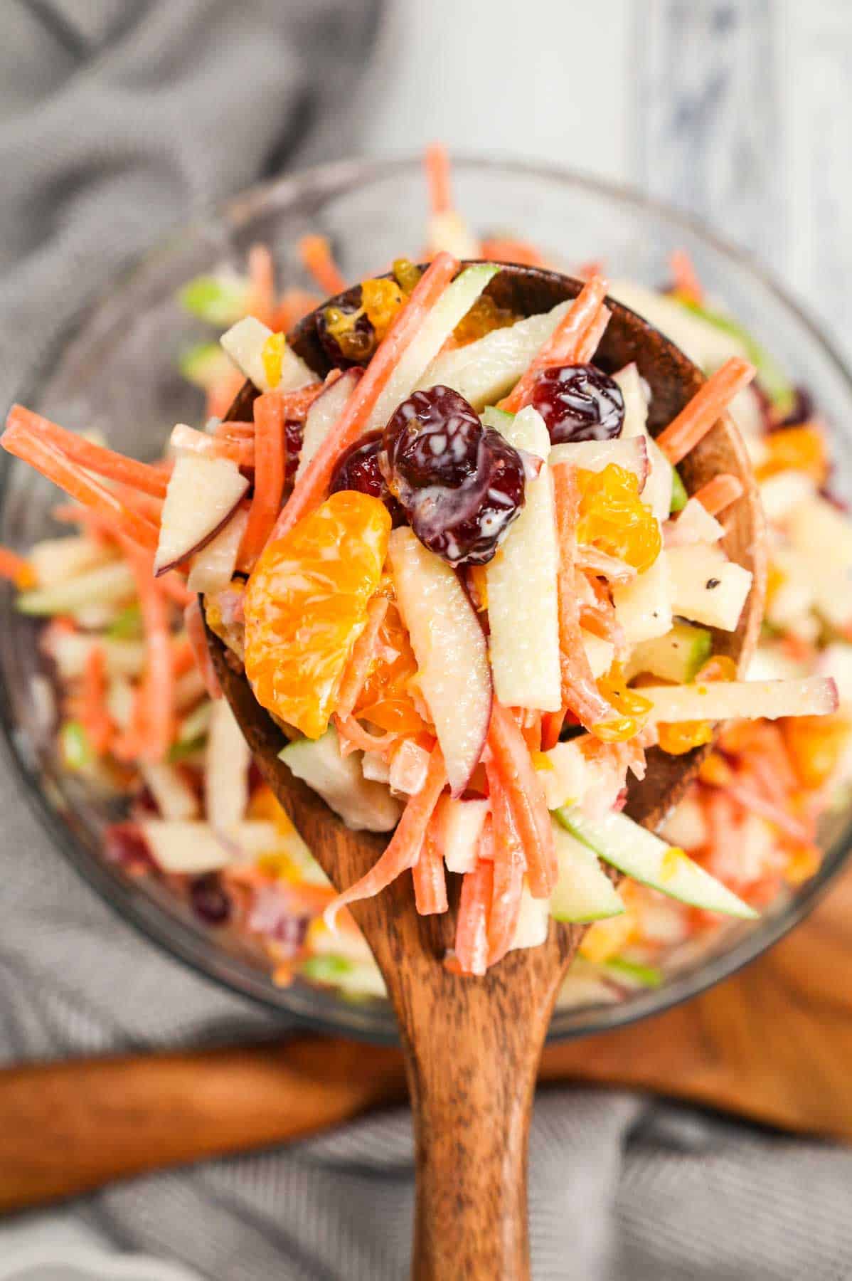 Carrot Apple Salad is a delicious and colourful salad loaded with sliced red and green apples, carrots, dried cranberries and mandarins all tossed in a vanilla yogurt and mayo dressing.