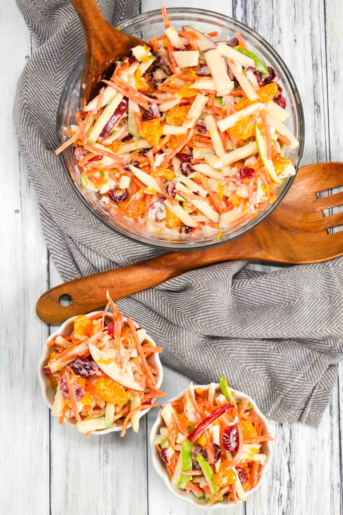 Carrot Apple Salad is a delicious and colourful salad loaded with sliced red and green apples, carrots, dried cranberries and mandarins all tossed in a vanilla yogurt and mayo dressing.