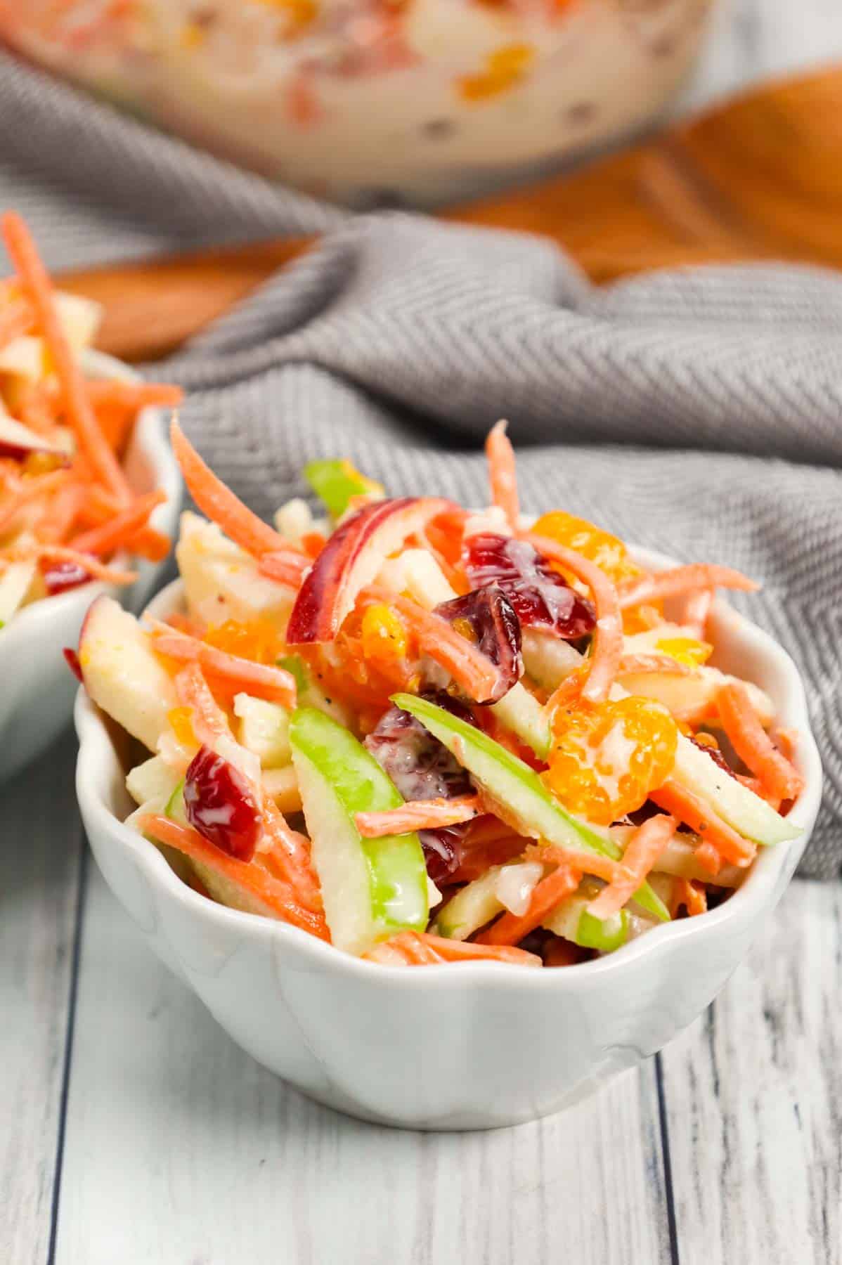 Carrot Apple Salad is a delicious and colourful salad loaded with sliced red and green apples, carrots, dried cranberries and mandarins all tossed in a vanilla yogurt and mayo dressing.