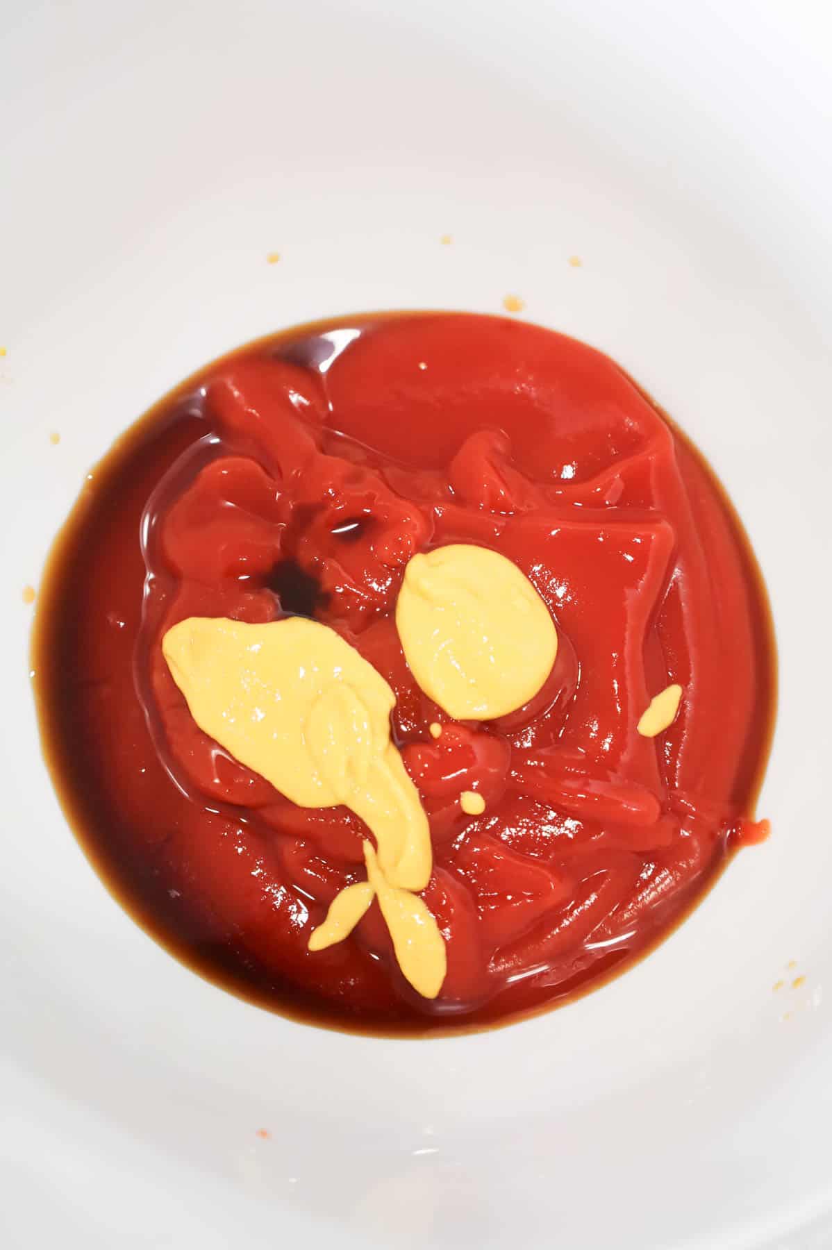 mustard and Worcestershire sauce on top of ketchup in a bowl