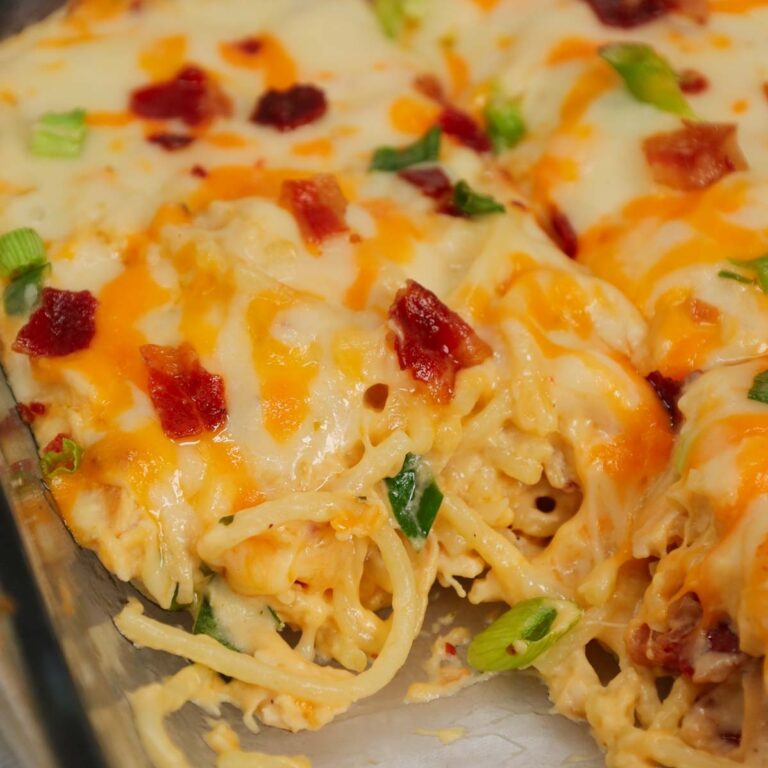 Crack Chicken Spaghetti is a delicious baked pasta recipe with a creamy sauce and loaded with shredded chicken, crumbled bacon, chopped green onions, ranch dressing mix and shredded cheddar and mozzarella cheese.