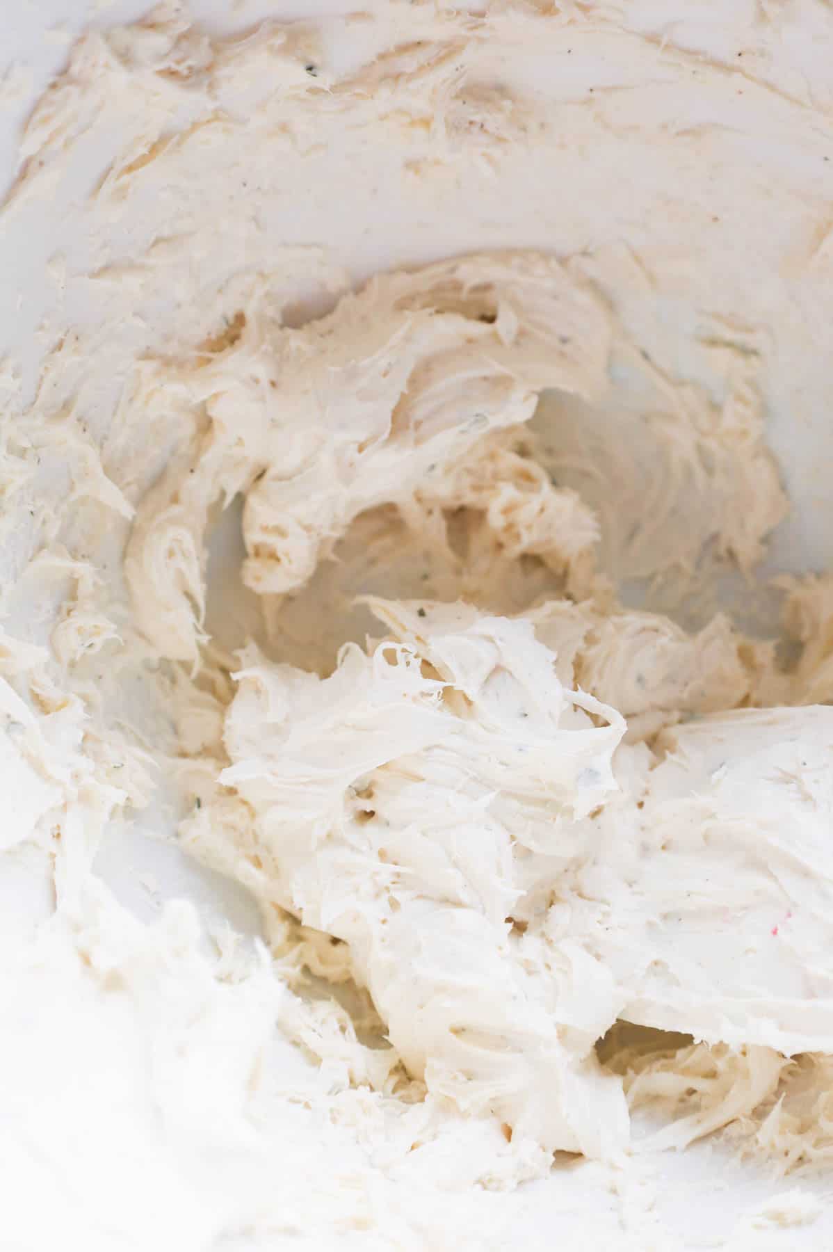 whipped cream cheese, milk and ranch dressing mix mixture in a bowl