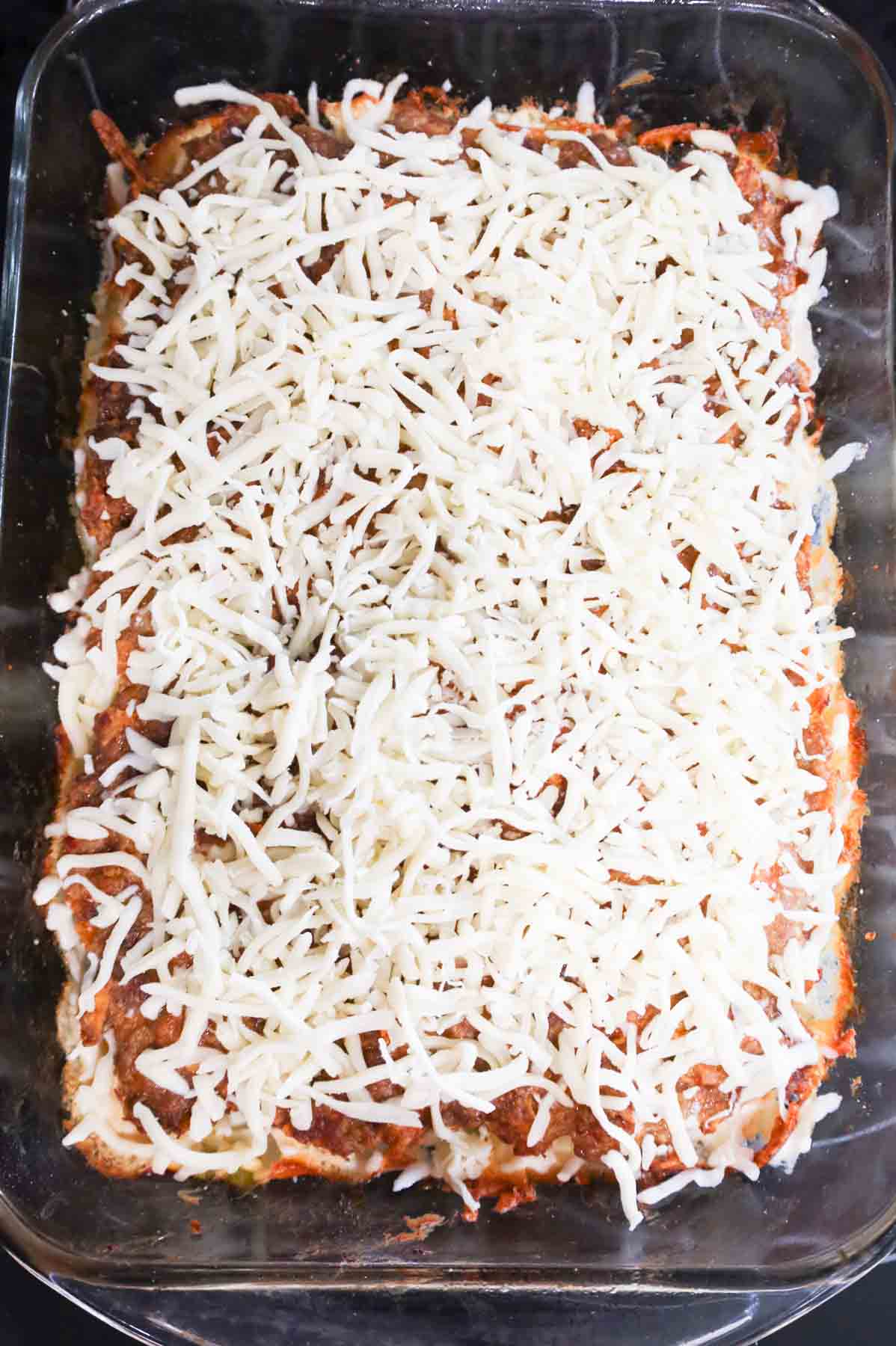 shredded cheese on top of meatloaf casserole