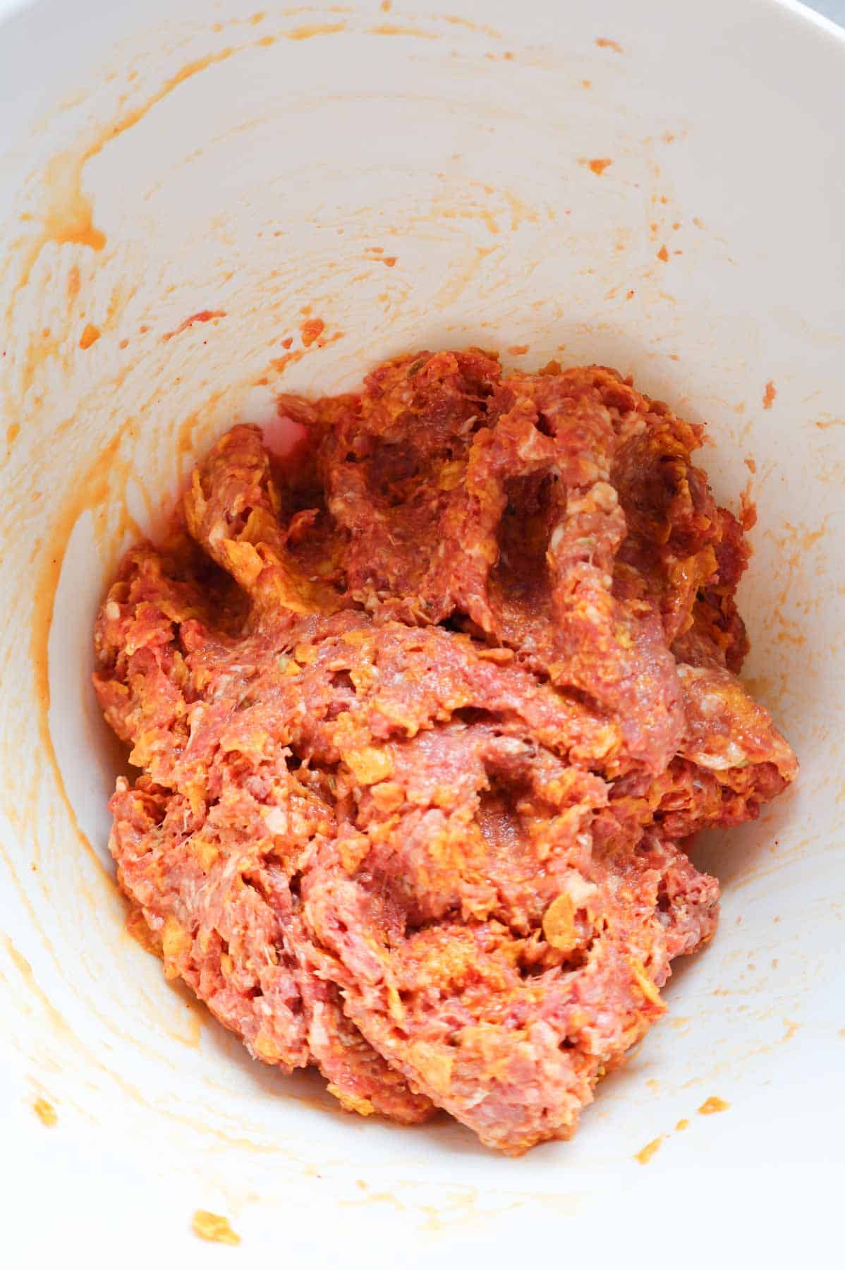 Dorito meatloaf mixture in a mixing bowl