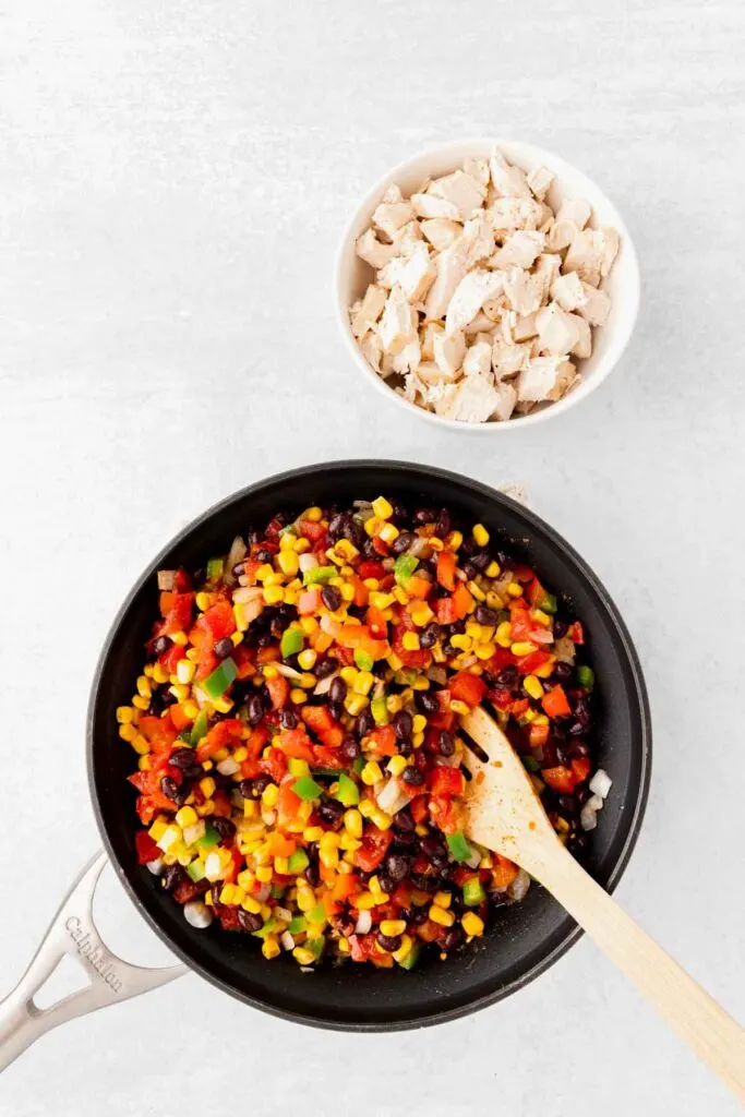 corn, black beans, diced peppers, onions, Rotel and spices combined in a skillet
