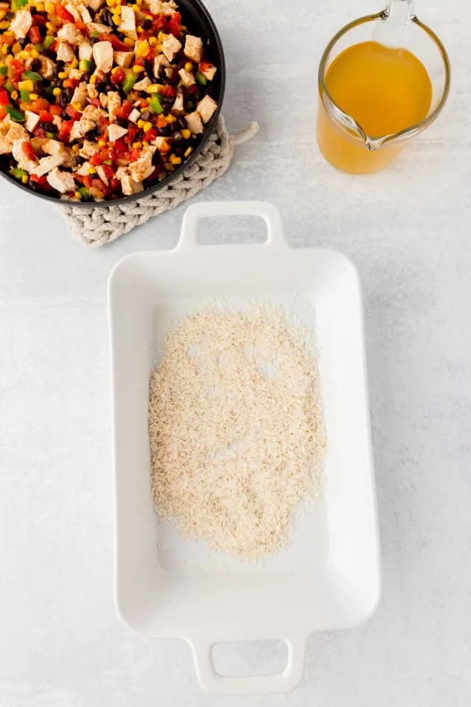 uncooked long grain white rice in a baking dish