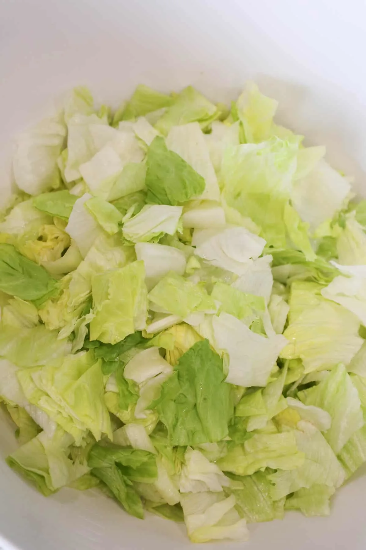 chopped iceberg lettuce in a large bowl