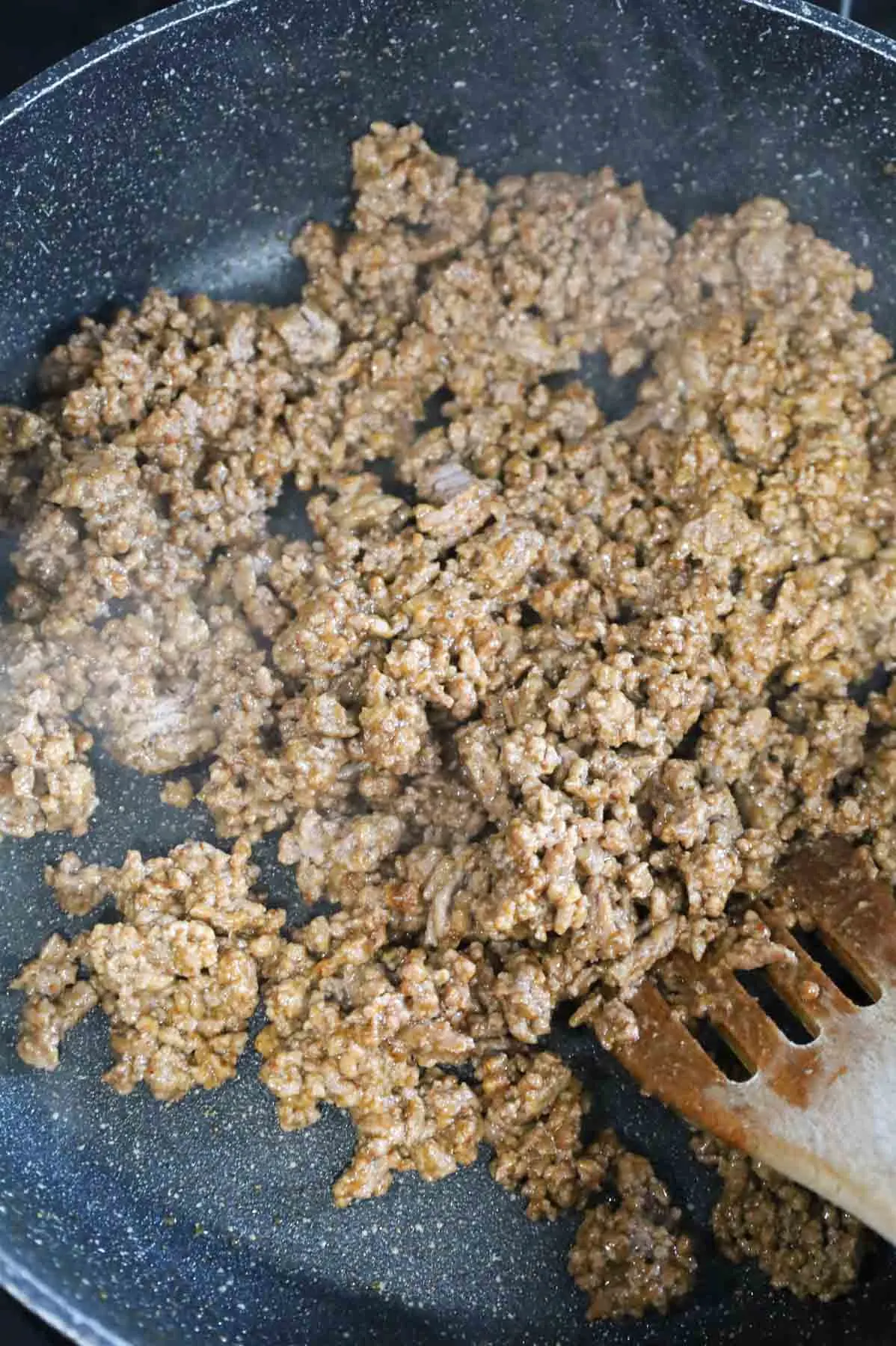 ground beef coated in taco seasoning in a skillet