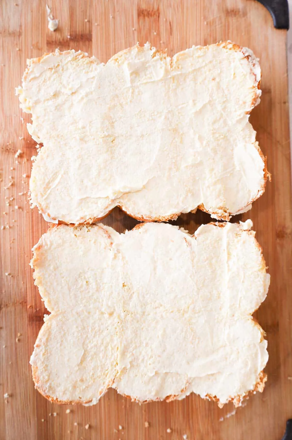 margarine spread on cut dinner rolls