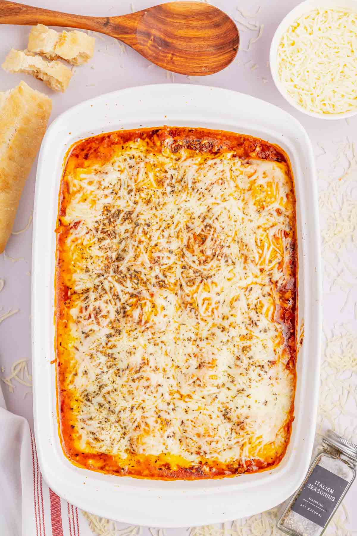 Lazy Lasagna with Ravioli is a hearty and delicious baked pasta recipe made with frozen cheese ravioli, ground beef, marinara and loaded with mozzarella cheese.