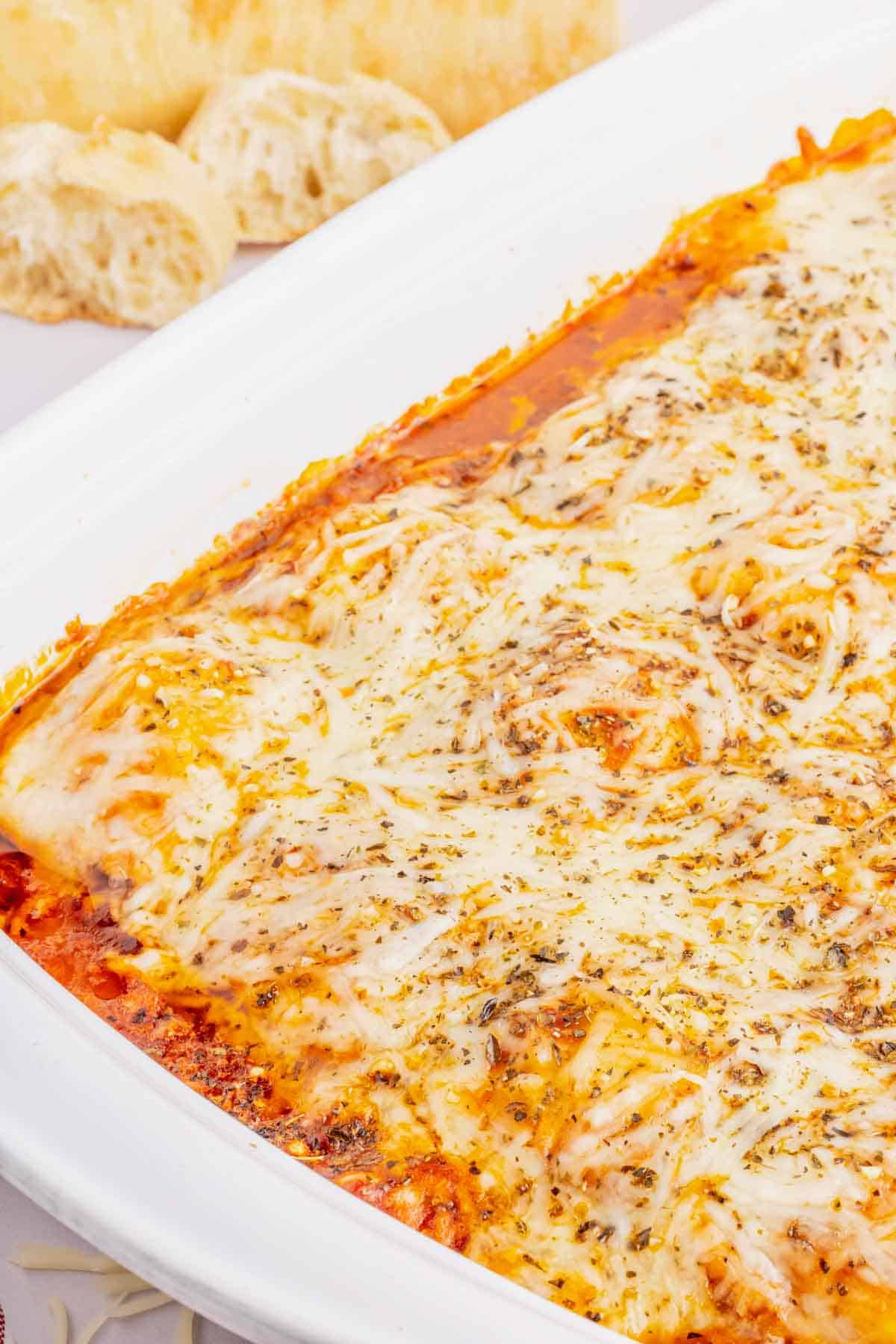 Lazy Lasagna with Ravioli is a hearty and delicious baked pasta recipe made with frozen cheese ravioli, ground beef, marinara and loaded with mozzarella cheese.