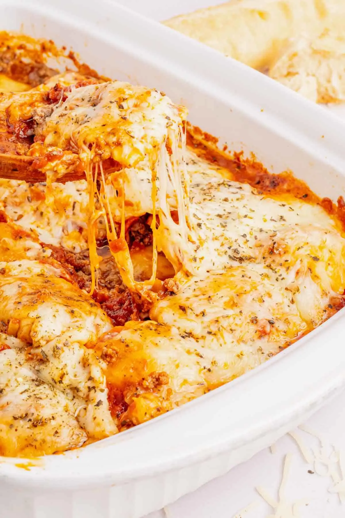 Lazy Lasagna with Ravioli is a hearty and delicious baked pasta recipe made with frozen cheese ravioli, ground beef, marinara and loaded with mozzarella cheese.