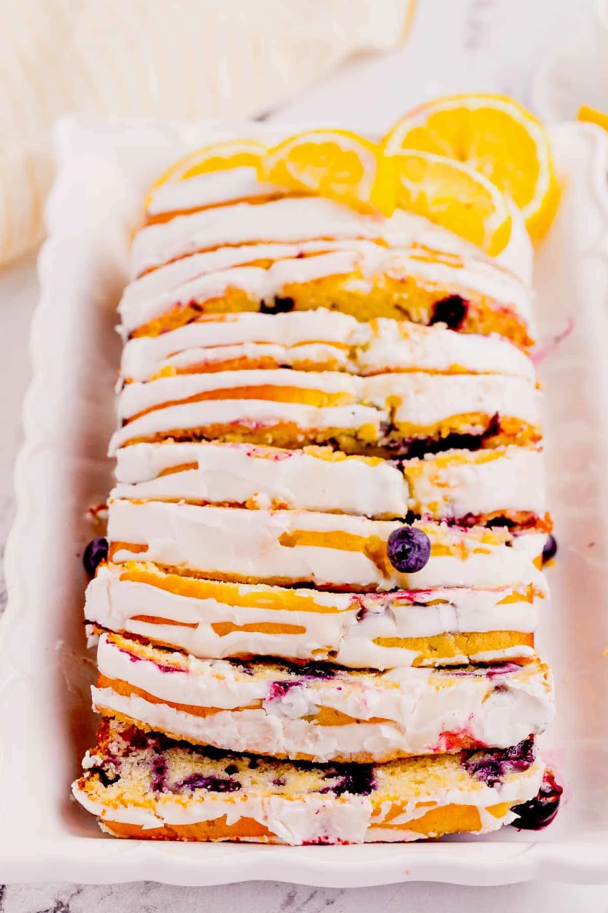 Lemon Blueberry Loaf is a delicious baked treat that combines the tangy flavor of lemons with the sweet burst of blueberries and is perfect for serving at brunch or as a dessert.